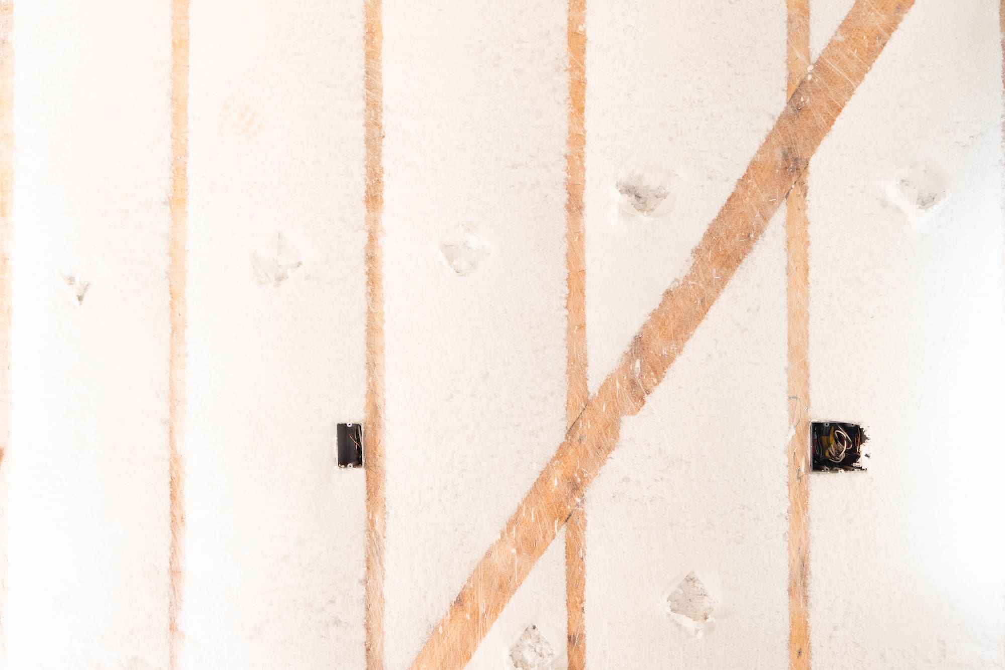 Loose Fill Fiberglass BABS Installed in a Wall